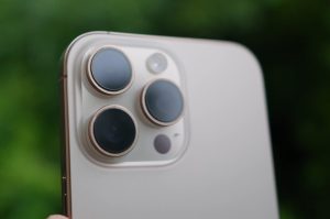 IPhone 16 pro max smartphone with triple camera setup and flashlight 