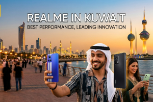 An advertising banner for realme phones in Kuwait, featuring people taking selfies on a vibrant waterfront with the iconic Kuwait Towers in the background during sunset. The image includes the realme logo and the text 'REALME IN KUWAIT, BEST PERFORMANCE, LEADING INNOVATION