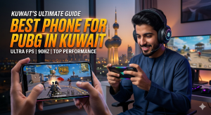 KUWAIT’S ULTIMATE GUIDE: BEST PHONE FOR PUBG IN KUWAIT" in bold orange letters, featuring a smiling man in a Thobe playing a game on a smartphone. Below the main text are technical details: "ULTRA FPS | 90HZ | TOP PERFORMANCE." The foreground shows close-up hands holding a smartphone with the PUBG Mobile game in action. In the background is a window view of the lit Kuwait Towers at night