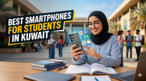 ​A smiling female university student wearing a hijab sits at an outdoor desk outside Kuwait University with textbooks and a laptop, interacting with a smartphone that displays floating educational app icons like Microsoft Teams. Large yellow and white text overlay reads: 'BEST SMARTPHONES FOR STUDENTS IN KUWAIT', making this a key image for identifying the Best Smartphone for Students in Kuwait