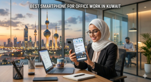 A professional woman wearing a white hijab and glasses is smiling and holding up a smartphone with productivity apps on its screen while at her desk. She is in a high-rise office with a panoramic window view of the Kuwait City skyline, including the iconic Kuwait Towers, at dusk. A laptop and office supplies are on her desk. The text "BEST SMARTPHONE FOR OFFICE WORK IN KUWAIT" is overlaid at the top of the image