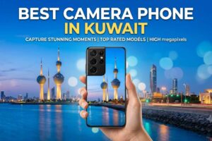 Hand holding a smartphone capturing a view of the Kuwait Towers and city skyline at sunset, with text reading BEST CAMERA PHONE IN KUWAIT